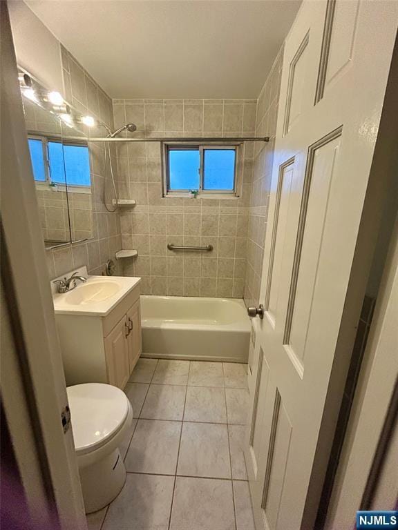 1481 E Terrace Cir Unit 4, Teaneck, NJ 07666 - full bath featuring tile patterned flooring, shower / bath combination, vanity, toilet, and tile walls
