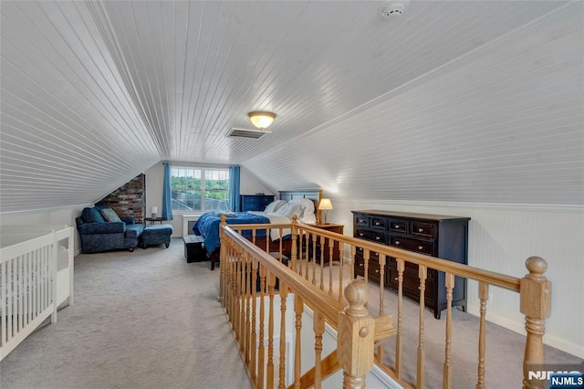 bedroom featuring carpet flooring, wooden ceiling, and vaulted ceiling