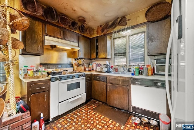 86 Fairview Ave, Teaneck, NJ 07666 - kitchen featuring white appliances, under cabinet range hood, light countertops, and a sink