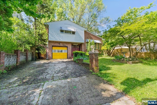 86 Fairview Ave, Teaneck, NJ 07666 - view of front of house with an attached garage, asphalt driveway, and brick siding