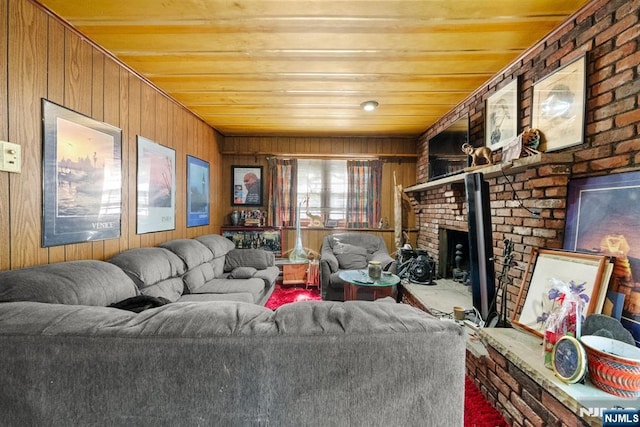 86 Fairview Ave, Teaneck, NJ 07666 - carpeted living room featuring wood walls, a brick fireplace, and wood ceiling