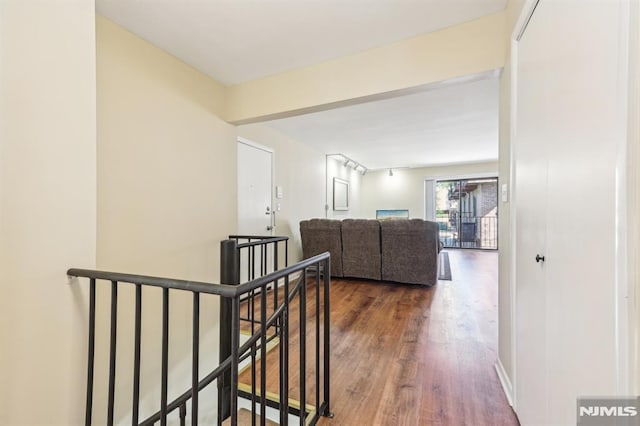 825 Riverside Unit 204, Lyndhurst, NJ 07071 - hallway with an upstairs landing and dark wood-style floors