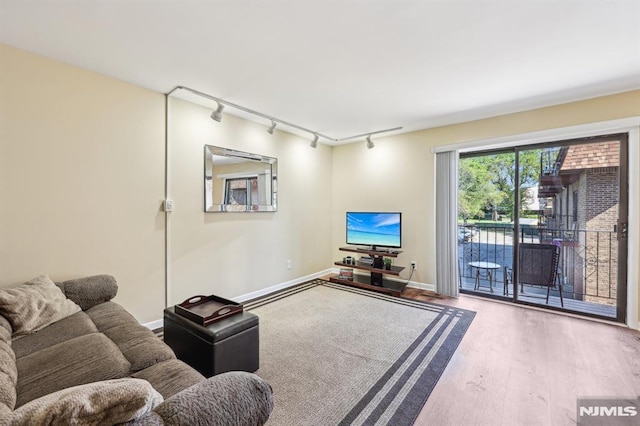 825 Riverside Unit 204, Lyndhurst, NJ 07071 - living area with track lighting, wood finished floors, and baseboards