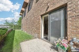 825 Riverside Unit 204, Lyndhurst, NJ 07071 - view of side of property featuring brick siding