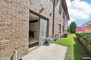 825 Riverside Unit 204, Lyndhurst, NJ 07071 - view of home's exterior with brick siding
