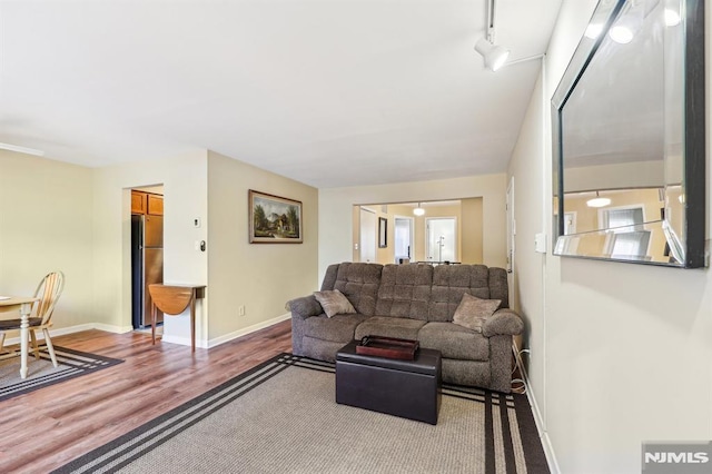 825 Riverside Unit 204, Lyndhurst, NJ 07071 - living area featuring wood finished floors and baseboards