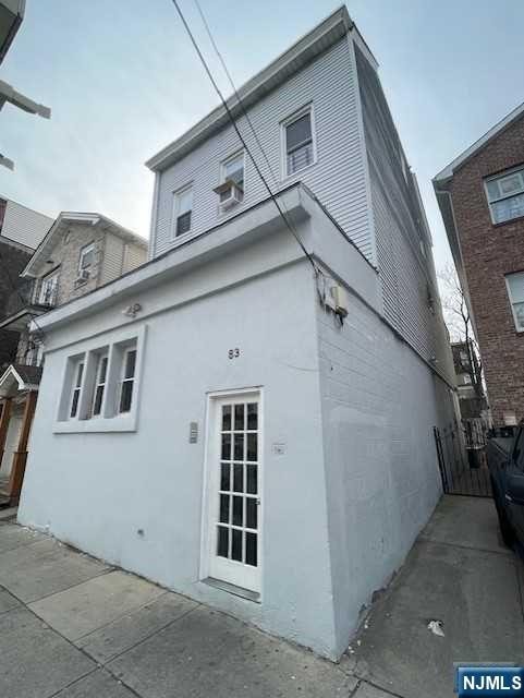 view of side of property with stucco siding