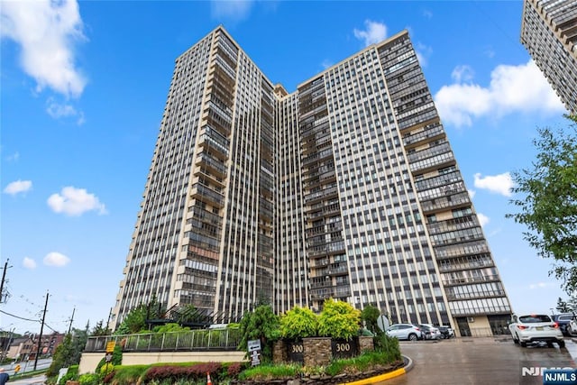 300 Winston Dr Unit 1817, Cliffside Park, NJ 07010 - view of building exterior featuring uncovered parking