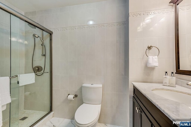 300 Winston Dr Unit 1817, Cliffside Park, NJ 07010 - bathroom with tile walls, vanity, a stall shower, and toilet