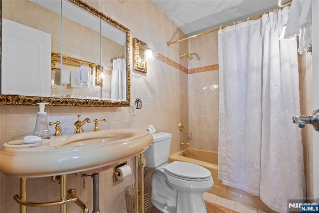 300 Winston Dr Unit 1817, Cliffside Park, NJ 07010 - full bathroom with tile walls, toilet, shower / bath combo with shower curtain, tile patterned floors, and a sink