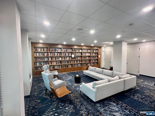 300 Winston Dr Unit 1817, Cliffside Park, NJ 07010 - carpeted living area featuring built in features, bookshelves, and a drop ceiling