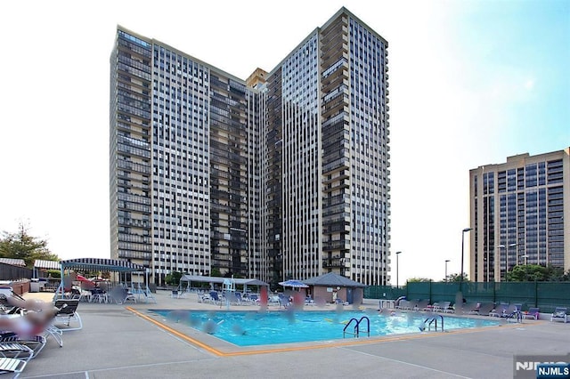 300 Winston Dr Unit 1817, Cliffside Park, NJ 07010 - community pool featuring a patio area