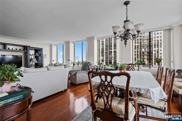 300 Winston Dr Unit 1817, Cliffside Park, NJ 07010 - dining area with a chandelier, crown molding, and dark wood-style floors
