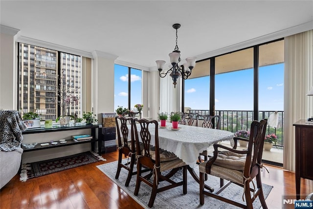 300 Winston Dr Unit 1817, Cliffside Park, NJ 07010 - dining room featuring a chandelier, a wall of windows, and wood finished floors