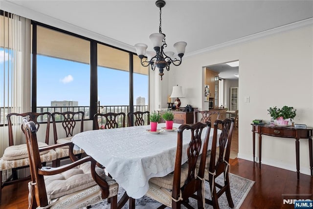 300 Winston Dr Unit 1817, Cliffside Park, NJ 07010 - dining room featuring a chandelier, wood finished floors, crown molding, and baseboards