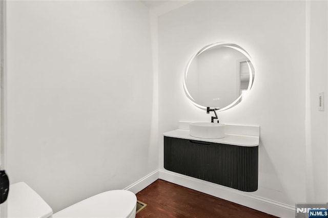 11 Deer Meadow Rd, Warwick, NY 10990 - half bath featuring toilet, wood finished floors, baseboards, and vanity