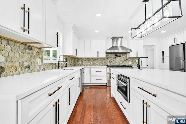 11 Deer Meadow Rd, Warwick, NY 10990 - kitchen with a sink, wall chimney exhaust hood, high quality appliances, light countertops, and recessed lighting