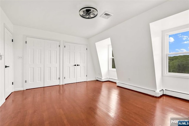 11 Deer Meadow Rd, Warwick, NY 10990 - unfurnished bedroom with multiple closets, wood finished floors, and baseboards