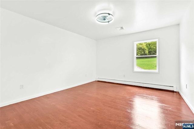 11 Deer Meadow Rd, Warwick, NY 10990 - empty room featuring a baseboard radiator, wood finished floors, and baseboards