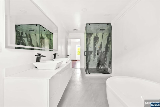 11 Deer Meadow Rd, Warwick, NY 10990 - bathroom featuring a marble finish shower, a freestanding tub, crown molding, double vanity, and tile patterned floors