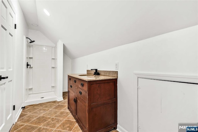 11 Deer Meadow Rd, Warwick, NY 10990 - full bathroom with vaulted ceiling, a shower stall, baseboards, recessed lighting, and vanity