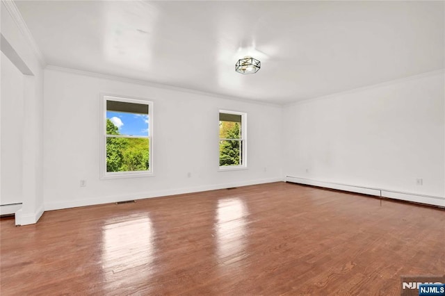 11 Deer Meadow Rd, Warwick, NY 10990 - empty room with crown molding, wood finished floors, a baseboard radiator, and baseboards