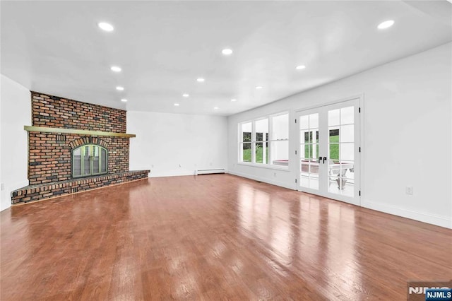 11 Deer Meadow Rd, Warwick, NY 10990 - unfurnished living room with baseboard heating, wood finished floors, recessed lighting, baseboards, and a fireplace