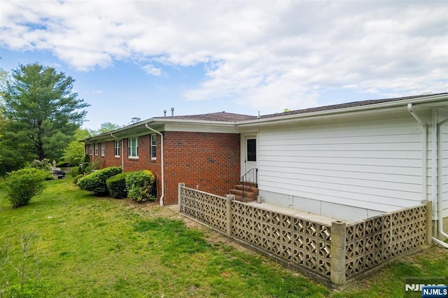 474 Laurel Brook Dr, Brick, NJ 08724 - rear view of house with entry steps, a yard, and brick siding