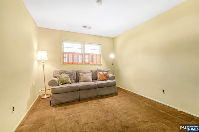 carpeted living room with baseboard heating and baseboards