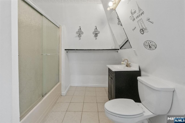 218 Waldo Pl, Englewood, NJ 07631 - bathroom featuring toilet, tile patterned floors, vanity, and shower / bath combination with glass door