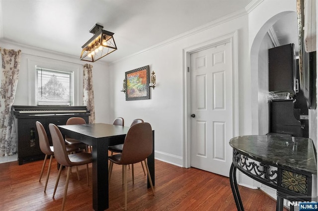 218 Waldo Pl, Englewood, NJ 07631 - dining room featuring crown molding, wood finished floors, baseboards, arched walkways, and a chandelier