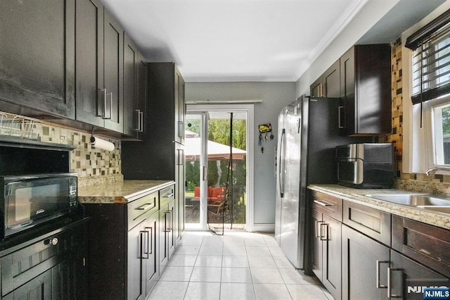 218 Waldo Pl, Englewood, NJ 07631 - kitchen with decorative backsplash, light tile patterned floors, crown molding, a sink, and healthy amount of natural light