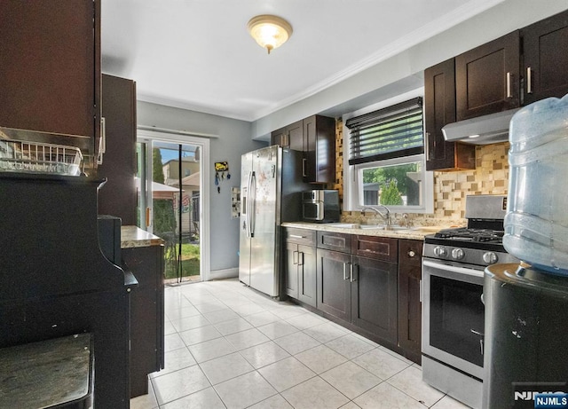 218 Waldo Pl, Englewood, NJ 07631 - kitchen featuring stainless steel appliances, a sink, tasteful backsplash, light tile patterned floors, and crown molding