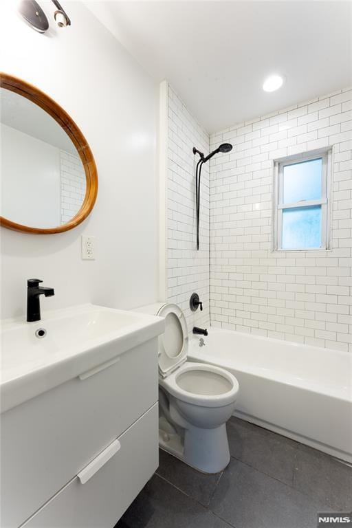 155 Liberty Rd, Teaneck, NJ 07666 - bathroom featuring tile patterned floors, vanity, toilet, and washtub / shower combination