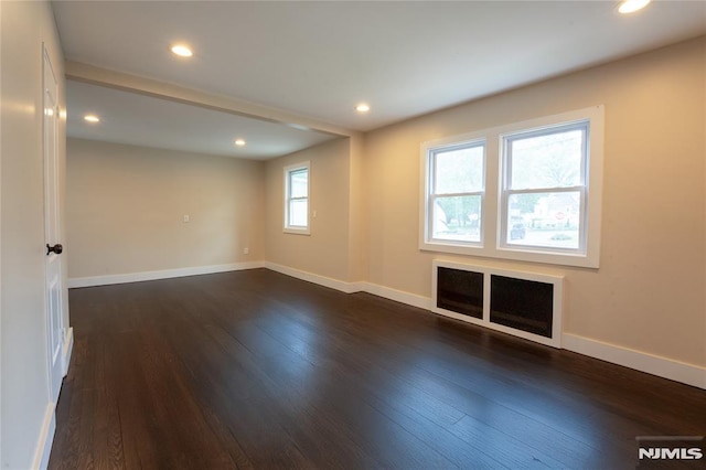 155 Liberty Rd, Teaneck, NJ 07666 - unfurnished room with dark wood finished floors, baseboards, and recessed lighting