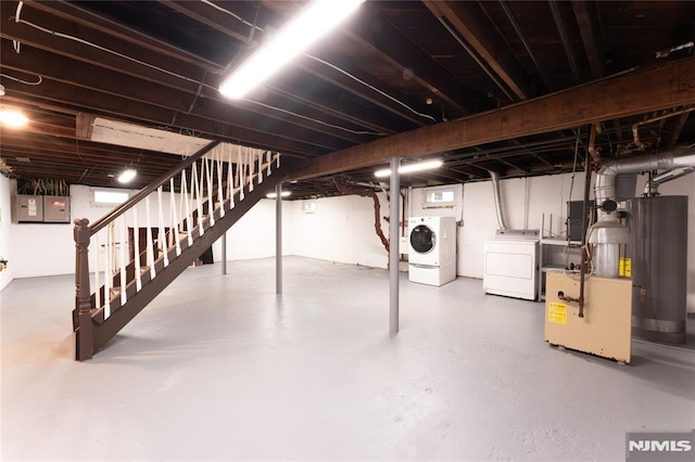 155 Liberty Rd, Teaneck, NJ 07666 - below grade area featuring washer and dryer, stairs, gas water heater, and electric panel
