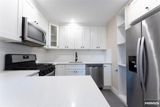 155 Liberty Rd, Teaneck, NJ 07666 - kitchen with appliances with stainless steel finishes, light countertops, a sink, and white cabinets