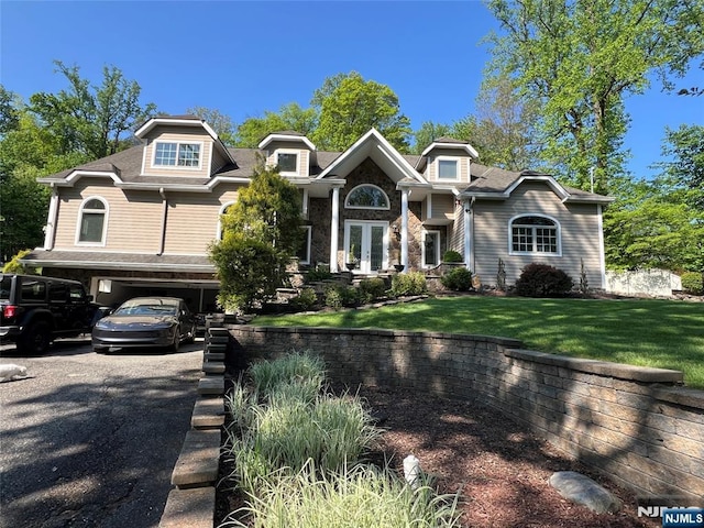 42 Cottontail Trl, Upper Saddle River, NJ 07458 - view of front of home featuring asphalt driveway, a front yard, and french doors