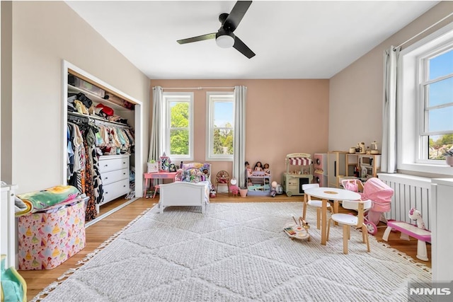 rec room featuring a ceiling fan and wood finished floors