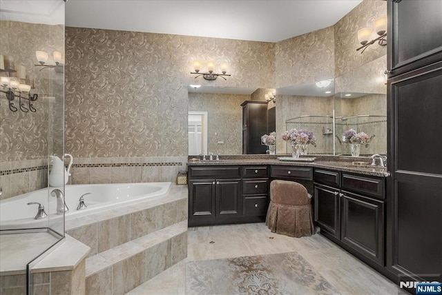 75 Windsor Ln, Ramsey, NJ 07446 - bathroom featuring a bath, double vanity, and wallpapered walls