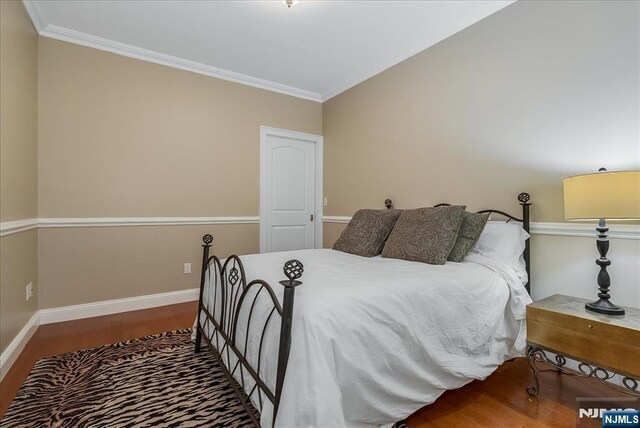 75 Windsor Ln, Ramsey, NJ 07446 - bedroom featuring wood finished floors, baseboards, and crown molding