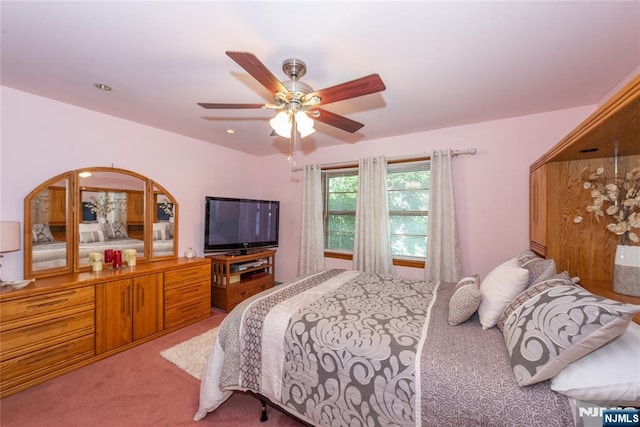 carpeted bedroom with ceiling fan