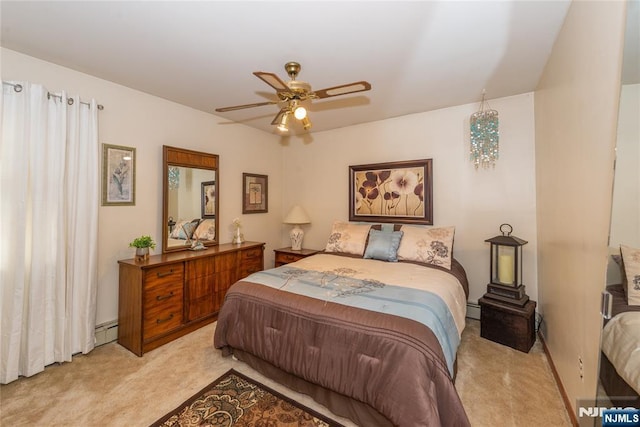 bedroom with light carpet, a baseboard heating unit, and a ceiling fan