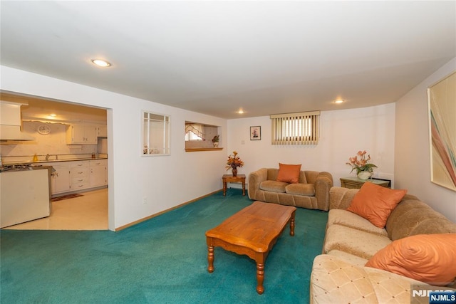 living room with light colored carpet, baseboards, and recessed lighting