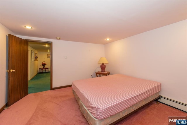 bedroom featuring light carpet, recessed lighting, a baseboard heating unit, and baseboards