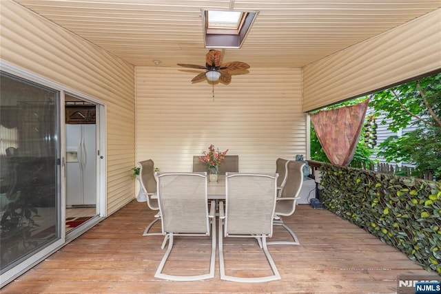 sunroom with outdoor dining space and ceiling fan