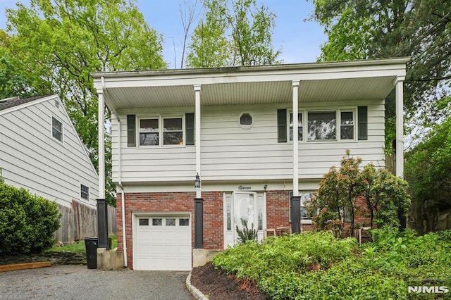 11 Beech Ct, Ringwood, NJ 07456 - view of front of home featuring brick siding, an attached garage, and driveway