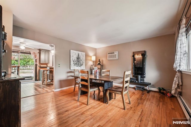11 Beech Ct, Ringwood, NJ 07456 - dining room with a baseboard heating unit, an AC wall unit, light wood-style floors, ceiling fan, and baseboards