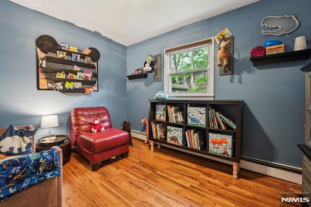 11 Beech Ct, Ringwood, NJ 07456 - sitting room featuring baseboard heating and wood finished floors