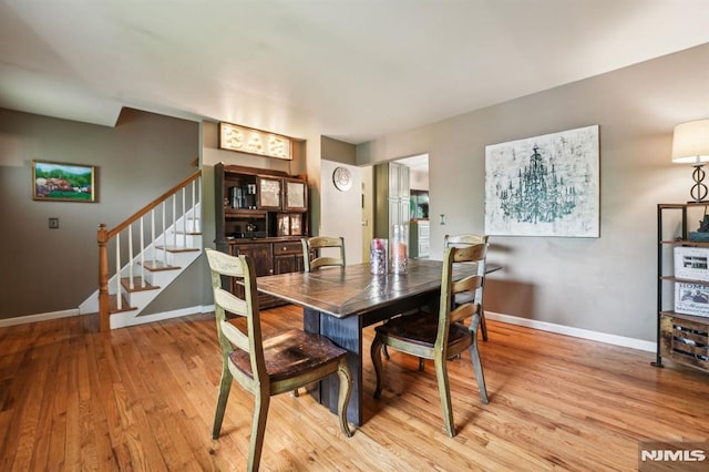 11 Beech Ct, Ringwood, NJ 07456 - dining area with light wood-type flooring, baseboards, and stairway